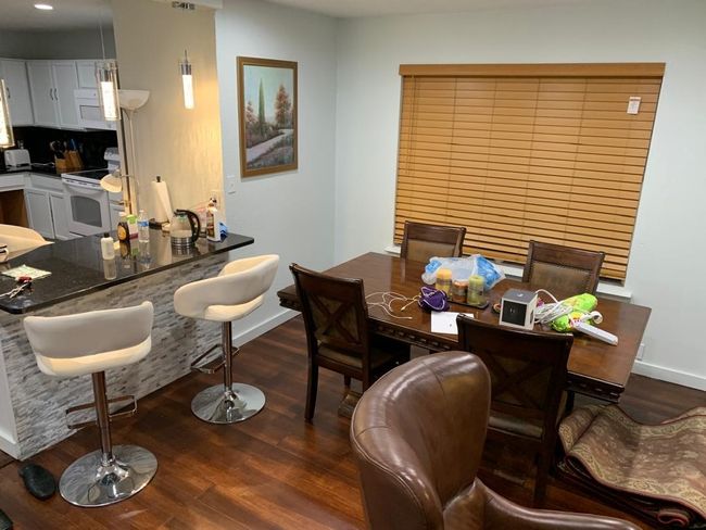 Dining room featuring dark wood-type flooring, baseboards, and recessed lighting | Image 18