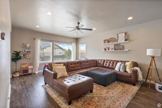 Living room featuring recessed lighting, baseboards, a ceiling fan, and dark wood-style floors | Image 17