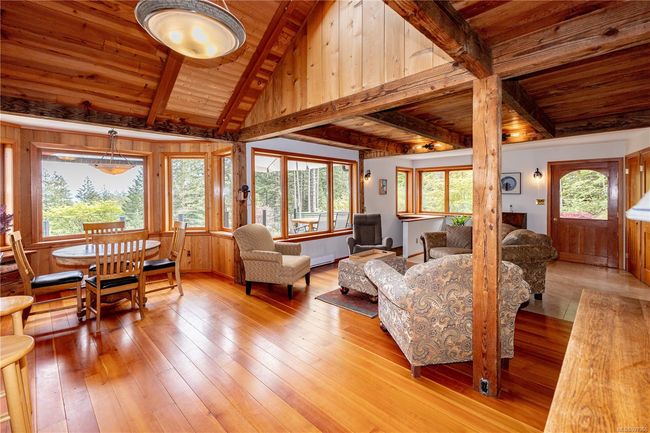 Open concept living space with skylit vaulted ceilings and gorgeous exposed beams | Image 14