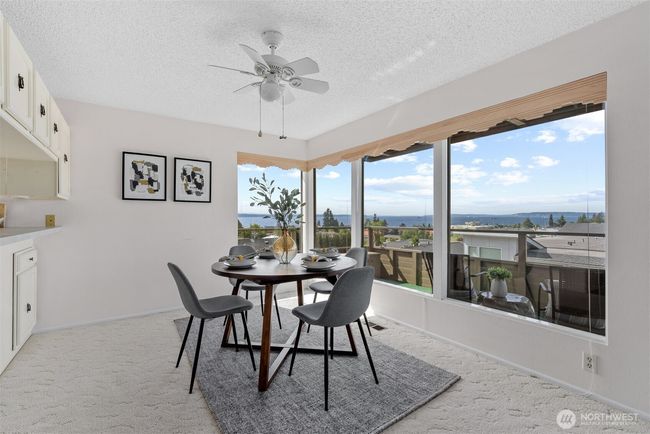 Formal dining area with a view! And a ceiling fan for those warm summer nights. | Image 12
