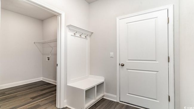 Mudroom with dark wood-type flooring | Image 10