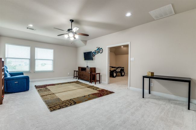 Living area with carpet, ceiling fan, and recessed lighting | Image 14