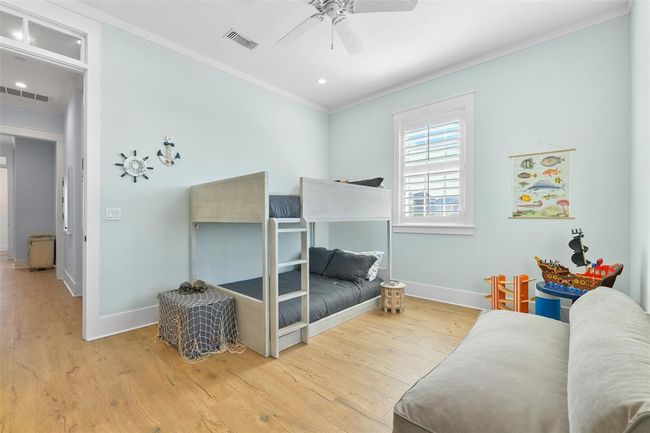 Another light-filled guest bedroom suite. | Image 33
