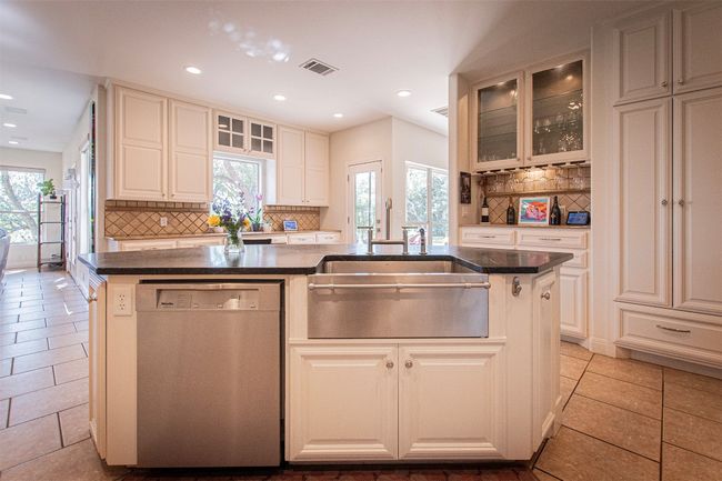 Kitchen with dishwasher, a sink, decorative backsplash, healthy amount of natural light, and recessed lighting | Image 14