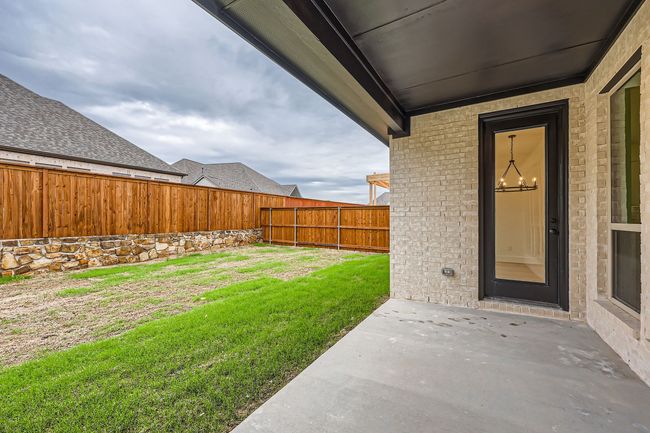 View of yard featuring a patio area and a fenced backyard | Image 26