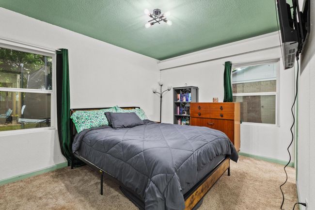 Bedroom featuring carpet, a textured ceiling, and baseboards | Image 18
