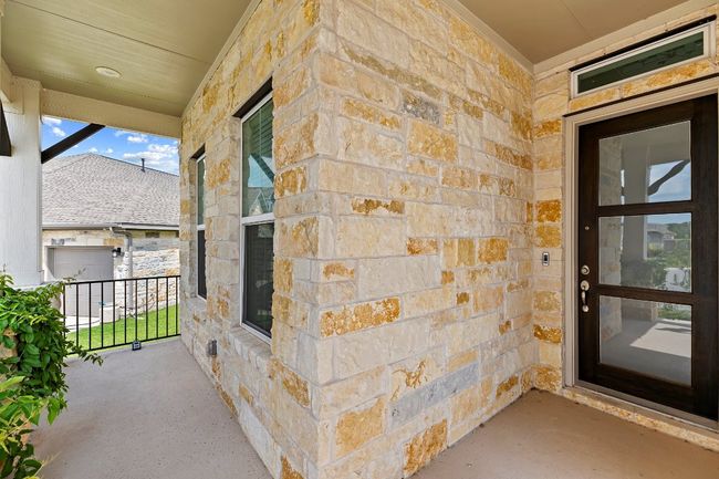 Entrance to property featuring stone siding | Image 38