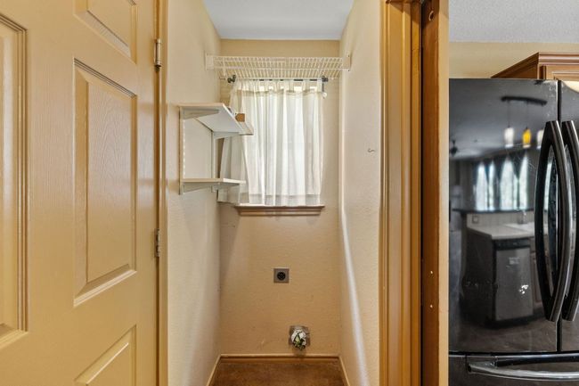 Laundry room with baseboards | Image 16