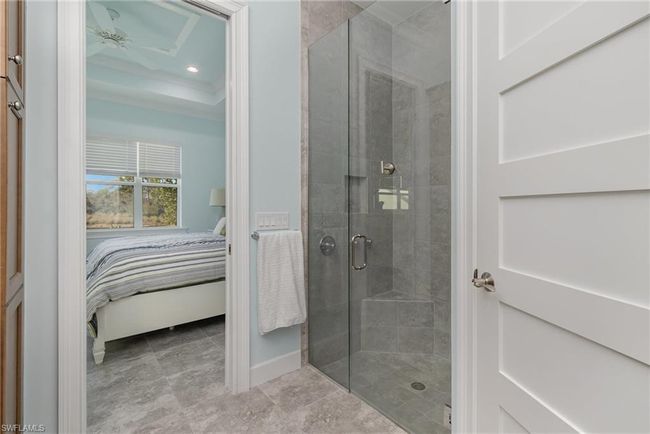 Bathroom featuring an enclosed shower | Image 11