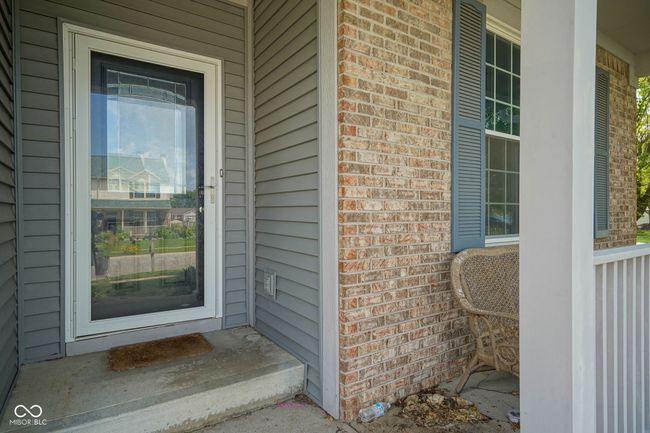 doorway to property with brick siding and covered porch | Image 4