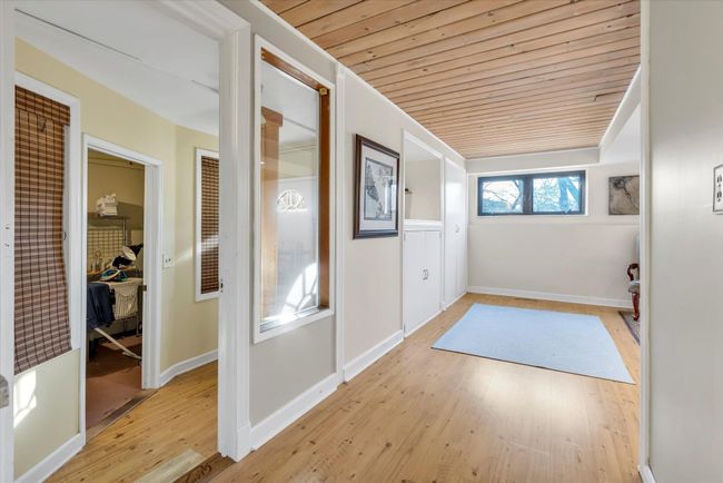 Doorway featuring wooden ceiling and light wood-type flooring | Image 25