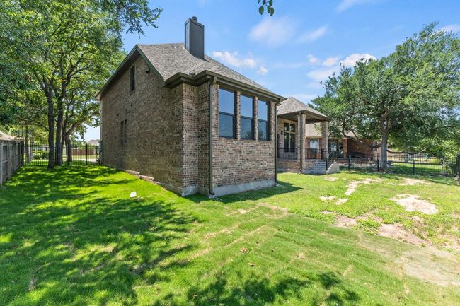 Rear view of property with brick siding and a​​‌​​​​‌​​‌‌​‌‌​​​‌‌​​‌‌​‌​​​​​‌ chimney | Image 33