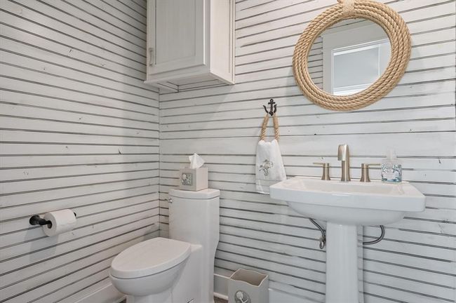 This powder room is located on the main level. | Image 24