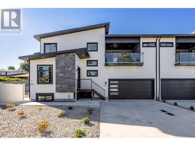 705 Mcclure Rd, Home with 5 bedrooms, 5 bathrooms and 2 parking in Kelowna BC | Image 1