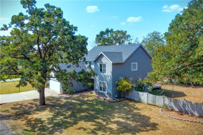 Aerial view of the home outside of city limits, but close to amenities. | Image 1