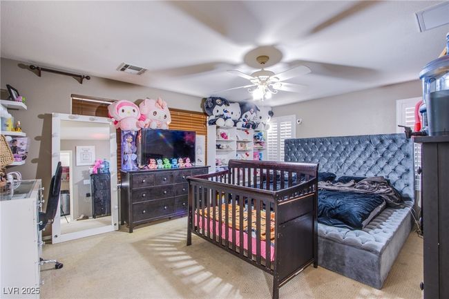 Bedroom with carpet floors and ceiling fan | Image 15