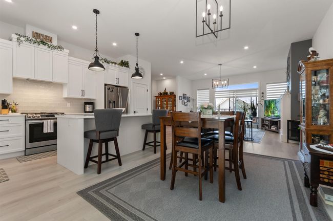Dining area with a chandelier, recessed lighting, and light wood finished floors | Image 10