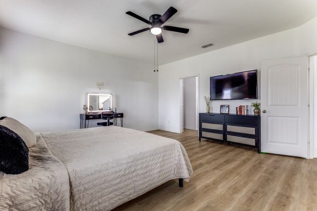 Bedroom featuring wood finished floors and a ceiling fan | Image 23