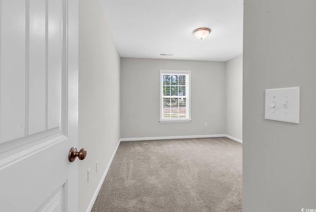 Carpeted spare room with baseboards | Image 16
