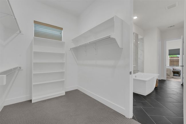 Walk in closet featuring visible vents | Image 23