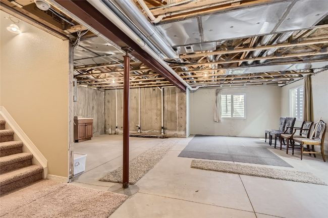 Large unfinished basement with lots of storage. Use your imagination to create additional living space. Already stubbed for an additional bathroom. Radon system and sump pump already installed. | Image 26