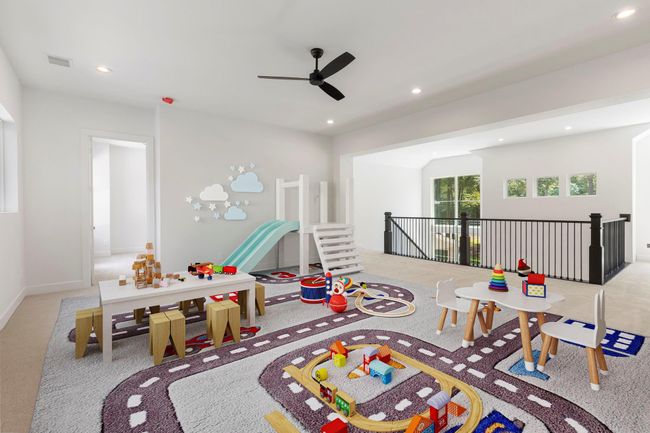 Upstairs is the first of two spacious game rooms. | Image 24