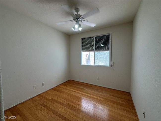 Empty room featuring light wood finished floors, a ceiling fan, and baseboards | Image 23