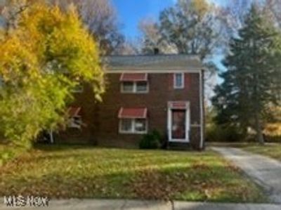 View of front facade with a front lawn | Image 1