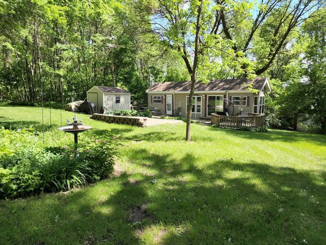 Huge front yard and great balance of sun and shade. Near the inground, heated swimming pool. | Image 11