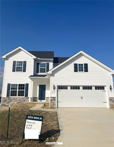 View of front of property featuring a garage | Image 1