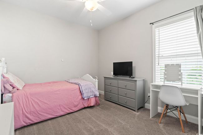 Carpeted bedroom featuring baseboards and ceiling fan | Image 20