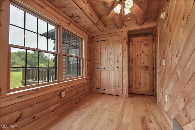 Second bedroom view of closet, windows and exit | Image 17