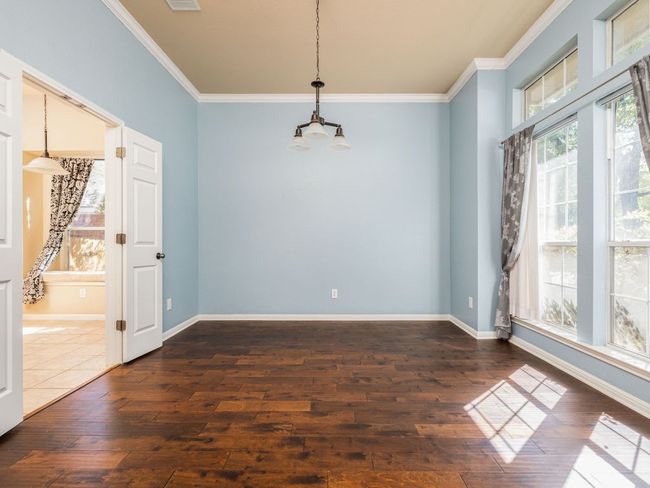 Formal dining room receives abundant natural light from the SSE-facing windows. | Image 6