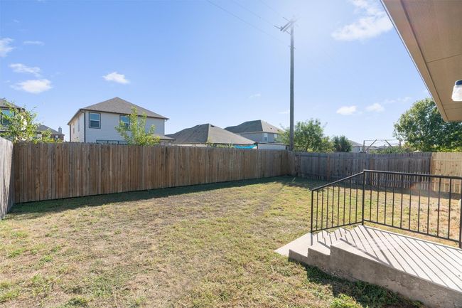 The backyard is enclosed by wood privacy fencing, which has recently undergone repairs for a fresh start! | Image 25