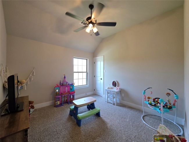 Playroom with vaulted ceiling, carpet flooring, and a ceiling fan | Image 28
