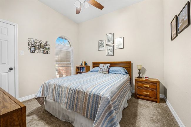 Bedroom featuring carpet floors, baseboards, and a ceiling fan | Image 22