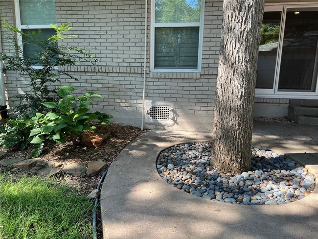 Exterior view of brick siding and crawl space | Image 27