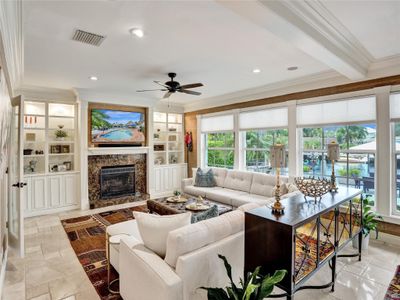 Huge family room with volume ceilings, pool and water views. | Image 3