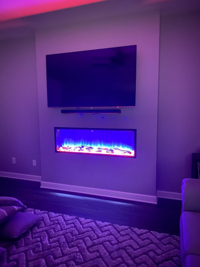 The fireplace has a remote so you can show whatever color fits the moment | Image 17
