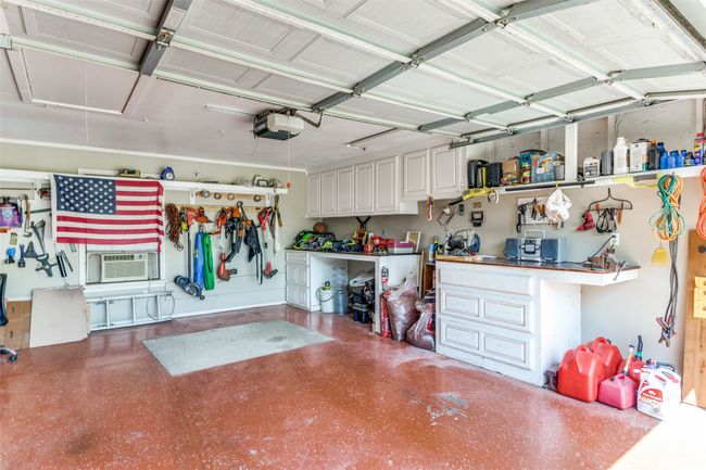 garage being used as workshop and storage. | Image 23