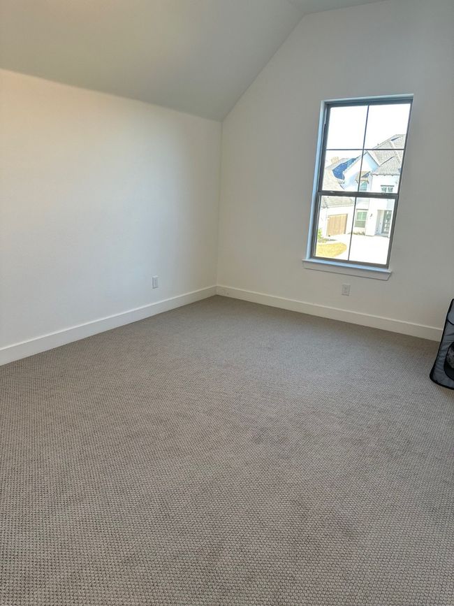 Additional living space featuring carpet, baseboards, and vaulted ceiling | Image 33