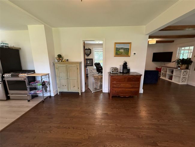 Main level office is located conveniently to the dining and living areas. | Image 11