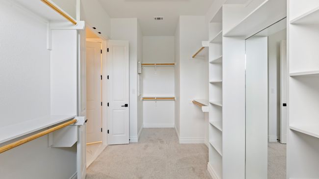 Walk in closet with light colored carpet | Image 30