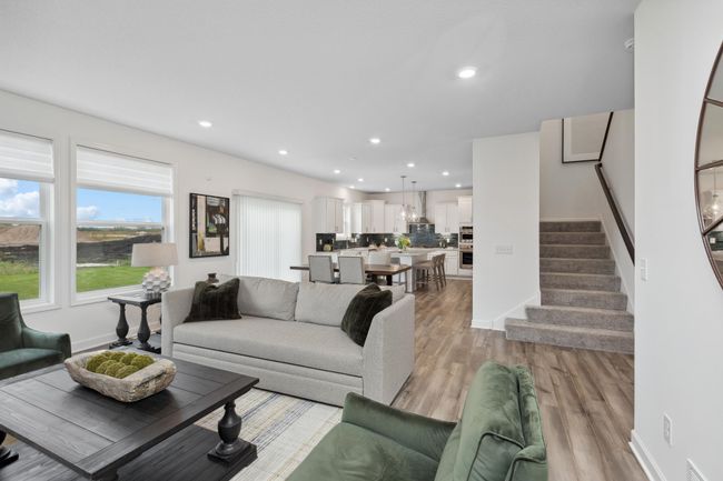 Photo is of the actual model. A view of the open-concept main level. | Image 8