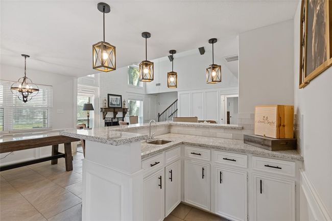Bar area opens to the living room and is perfect for entertaining. | Image 16
