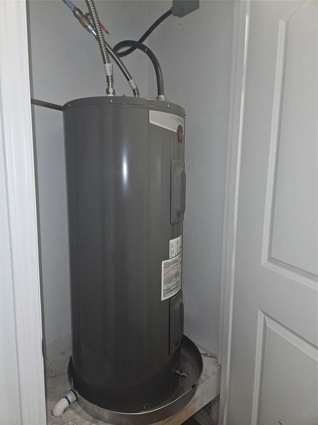 Utility room featuring water heater | Image 19