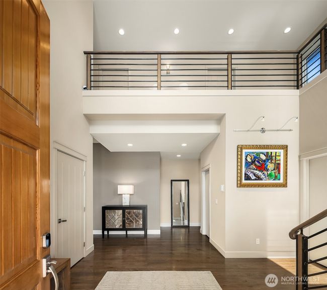 Step through a dramatic entry two story entry with a beautiful custom railing. | Image 4