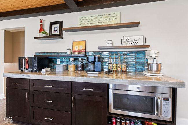 Coffee Bar, stainless steel microwave, beamed ceiling, and wooden ceiling | Image 17