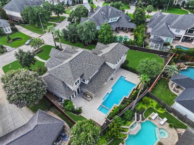 A lovely view overhead showing the home (with brand new roof), pool and yard space. Plenty of space to relax in! | Image 3