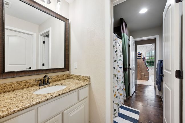 Full bath featuring vanity, tile patterned flooring, recessed lighting, and a shower with shower curtain | Image 29